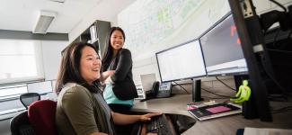 2 people working on computer