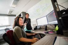 2 people working on computer